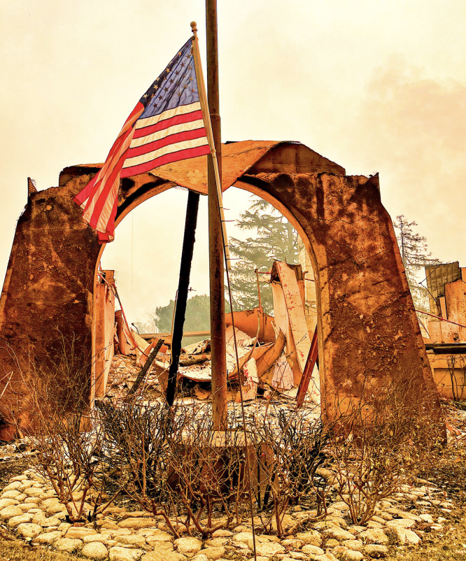 THE STARS AND STRIPES FLY proudly at the burned Altadena Country Club